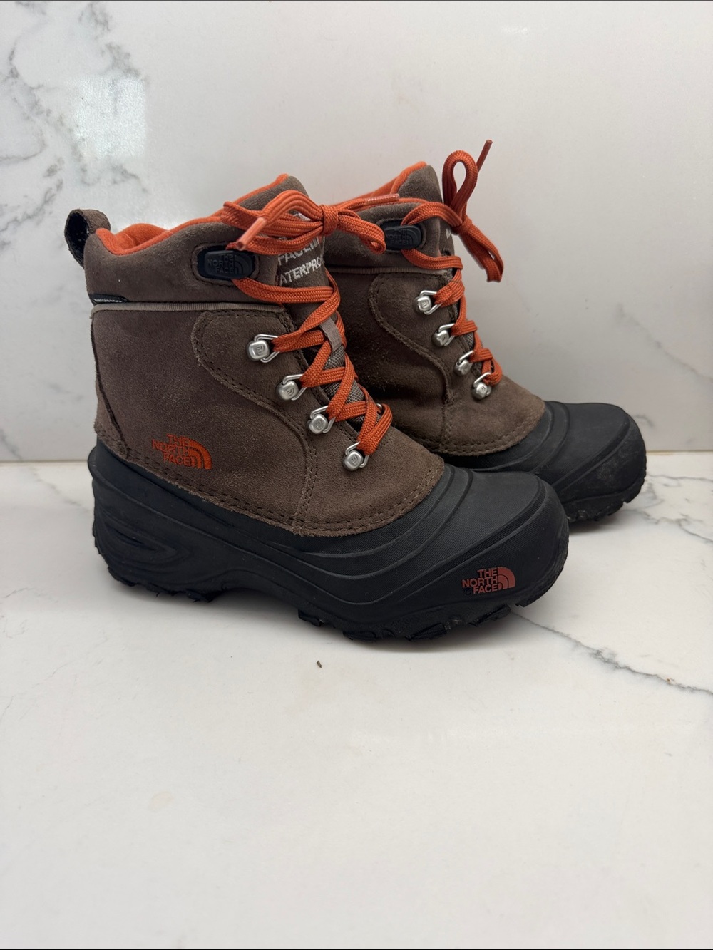 The North Face Brown Suede Kids Boots with Orange Laces
